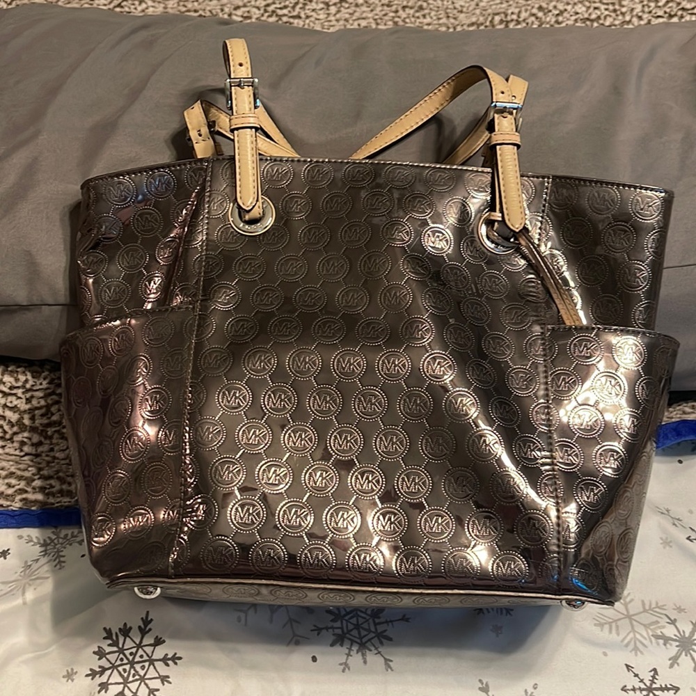 Michael Kors handbag - used - great condition - shiny silver color